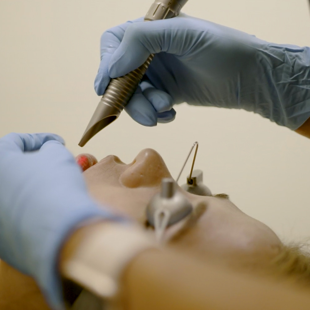 Woman getting lip treatment done