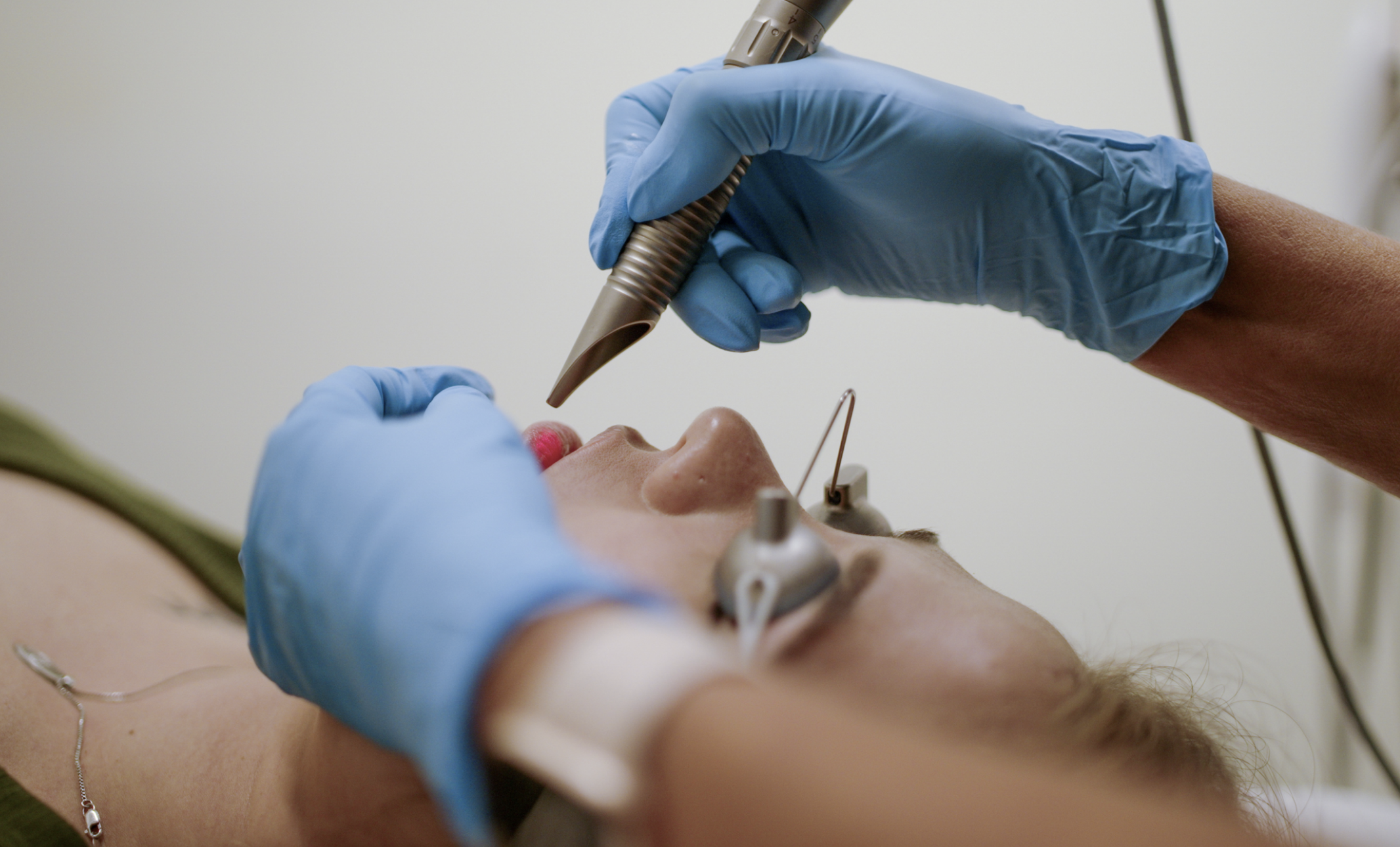 Woman getting lip treatment done