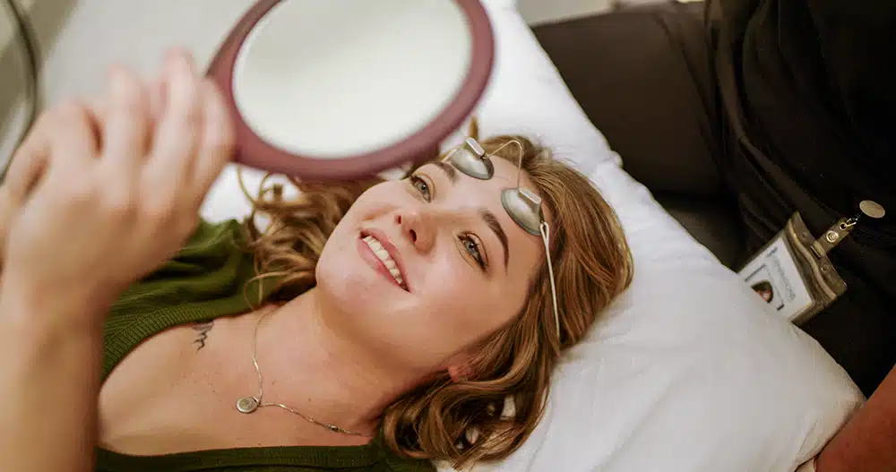 1772672567_B-Roll.00_19_27_16.Still089 Client Looking at Mirror